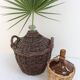 Demijohn in her braided wicker basket