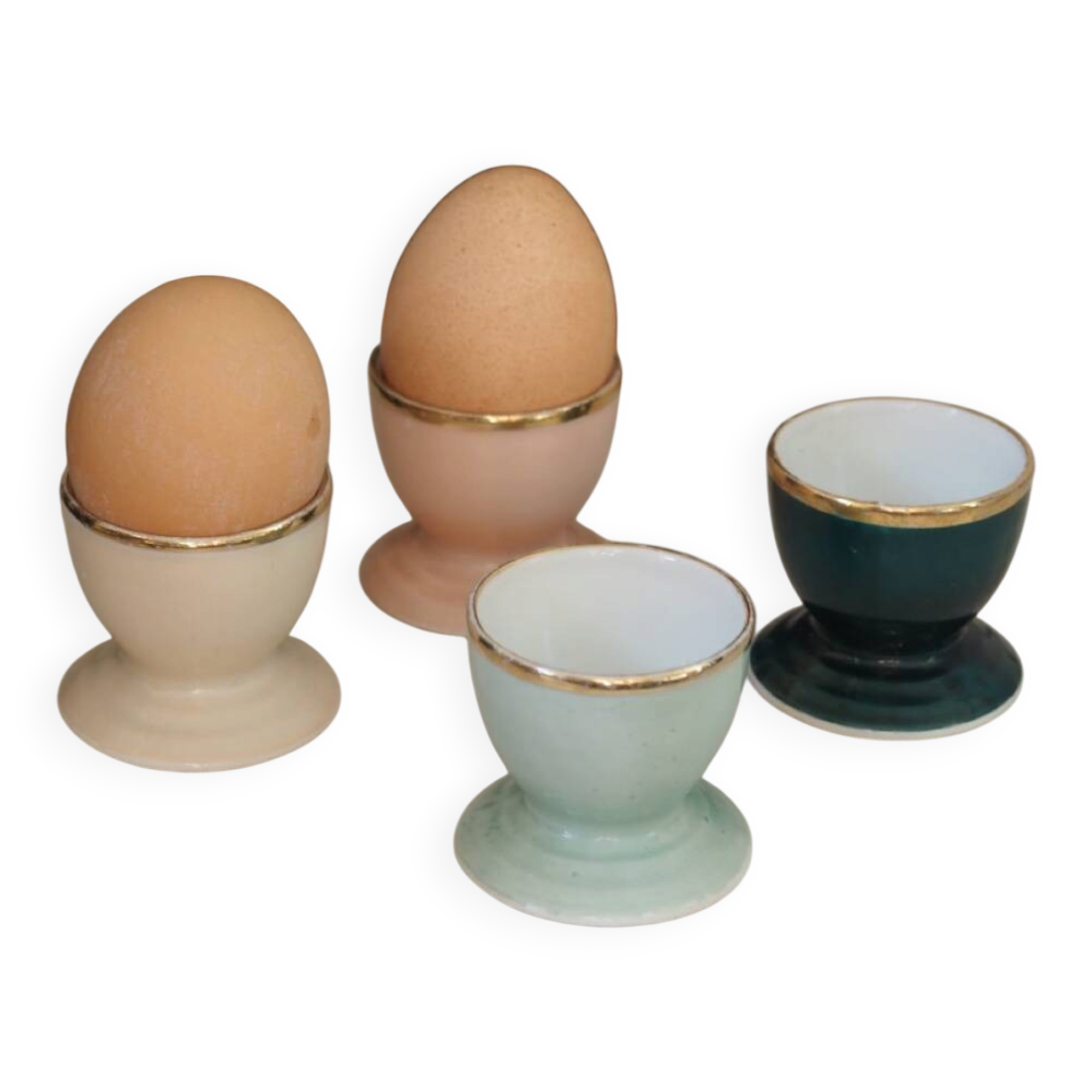Four coloured egg cups with a golden rim from the 50s.