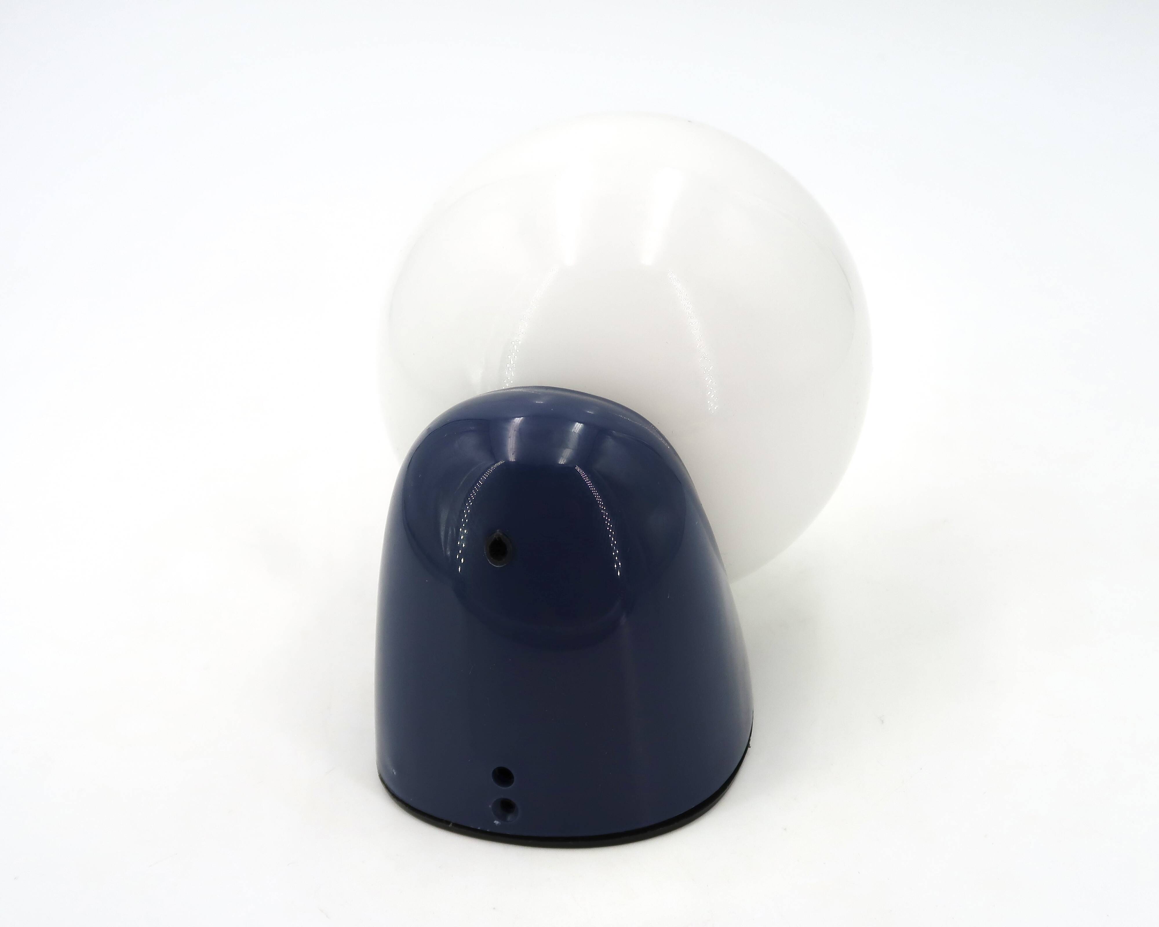 Tissot wall light in dark blue with a white opaque glass globe