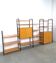 Système de mur modulaire Ikea Niklas avec armoires et étagères vintage.