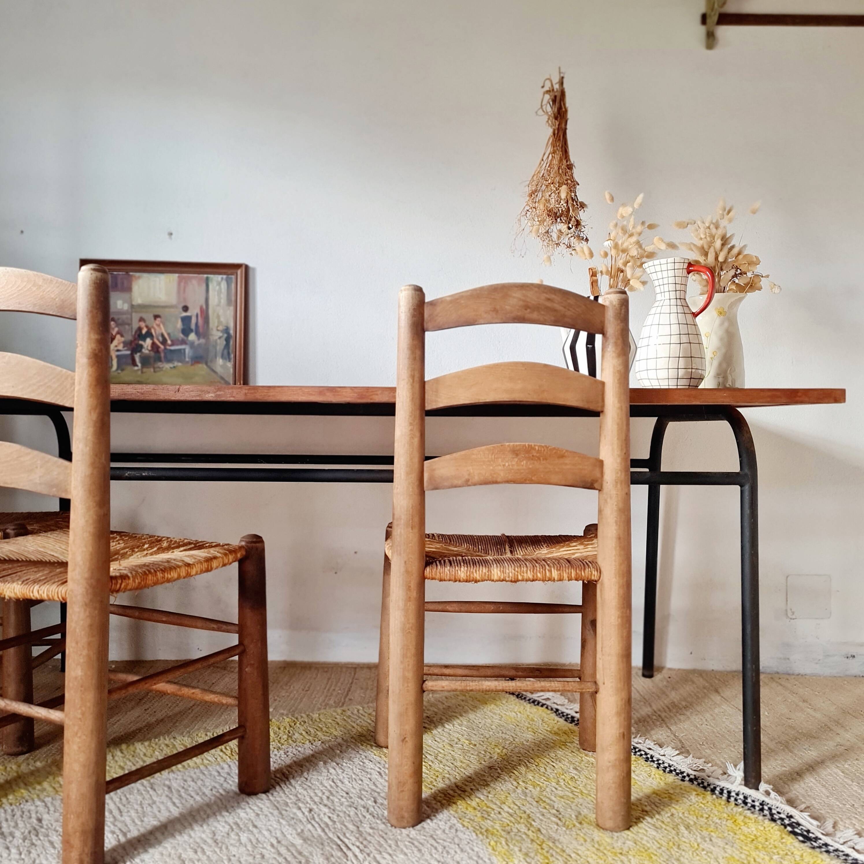 Metal tubular base table with a wooden top.