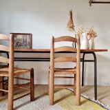 Metal tubular base table with a wooden top.