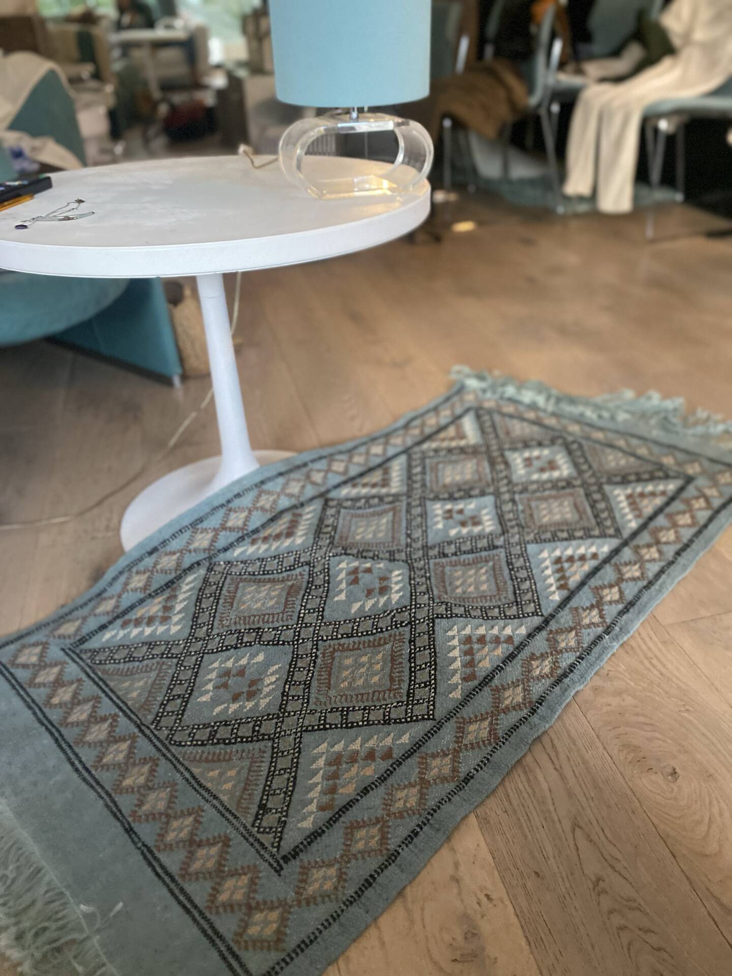 Handmade turquoise and beige wool rug, new.