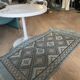 Handmade turquoise and beige wool rug, new.