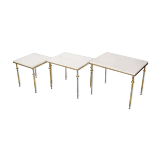 Pull-out tables in marble and brass