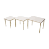 Pull-out tables in marble and brass