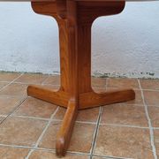 Scandinavian coffee table in solid pine with tripod legs in Swedish chalet style.