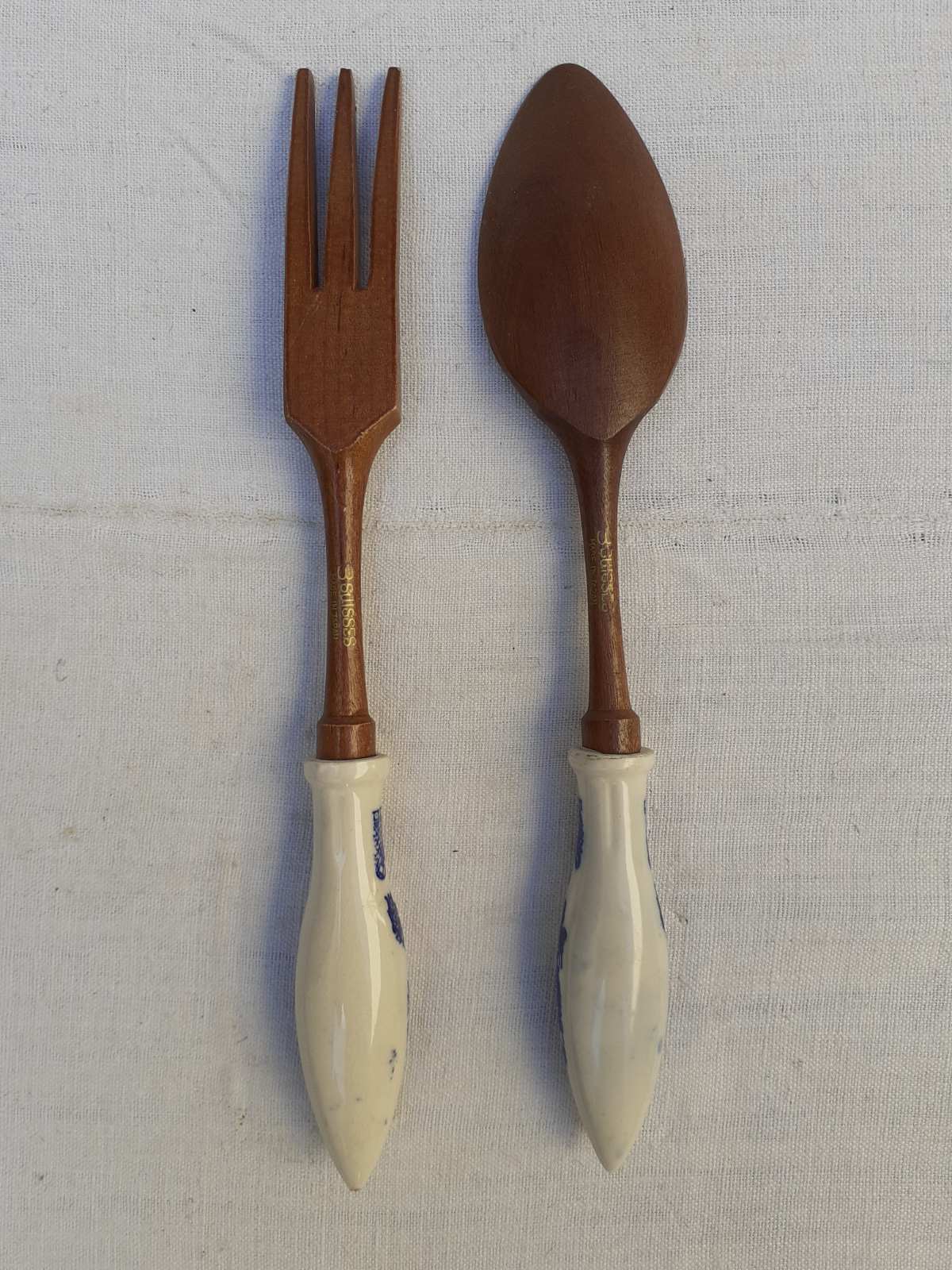 Wooden and porcelain salad covers