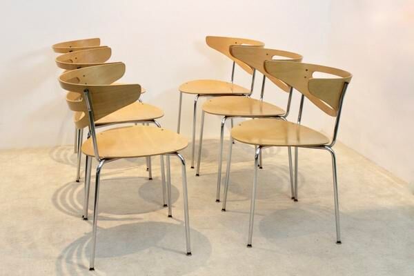Thonet curved dining chairs stacked in chrome and beech