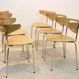 Thonet curved dining chairs stacked in chrome and beech