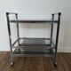 Stainless steel bar and smoked glass serving table