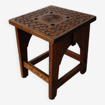 Old carved wooden stool, popular craftsmanship