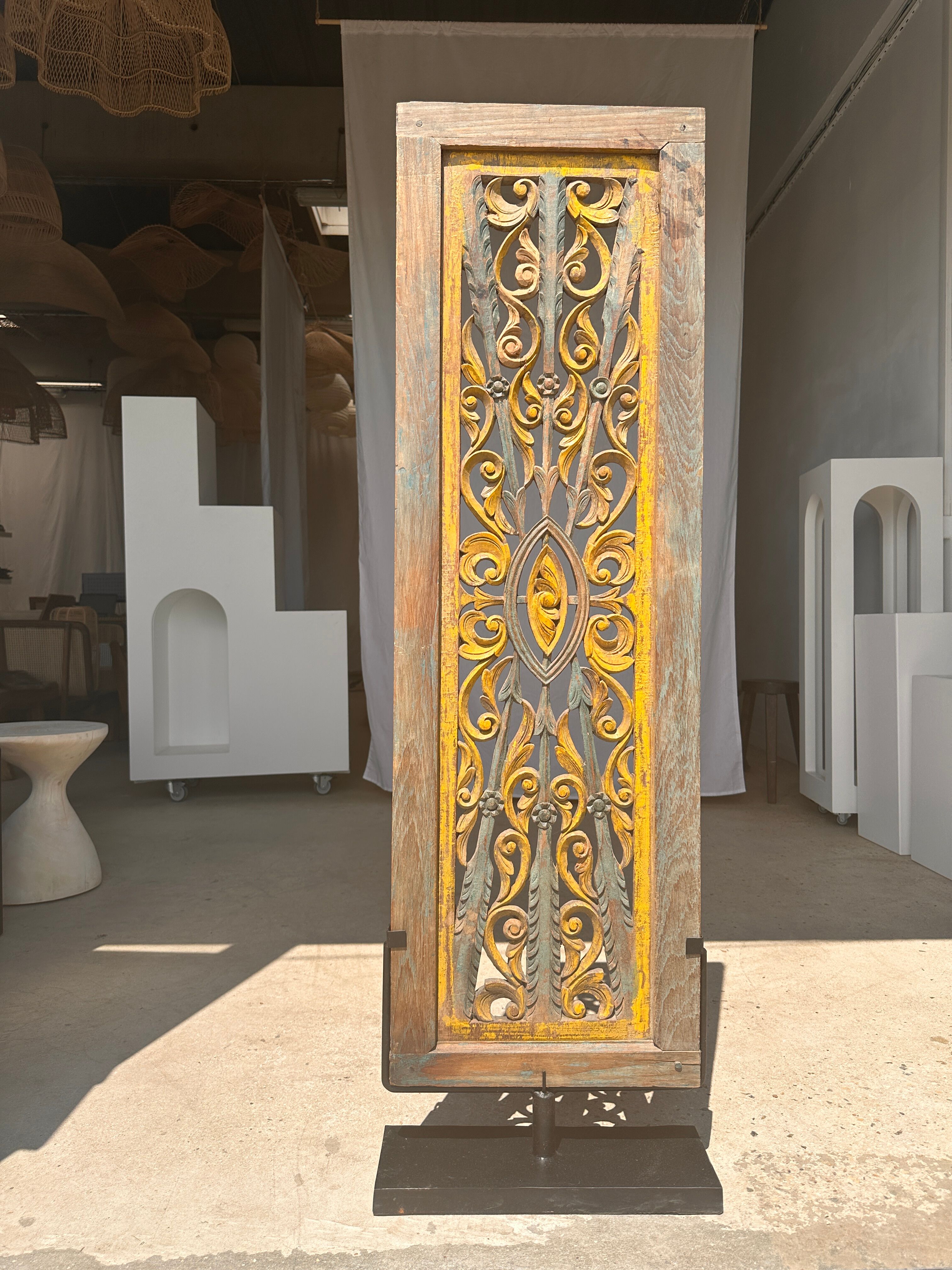 Rectangular Indonesian construction element with blue and yellow plant in carved wood