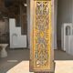 Rectangular Indonesian construction element with blue and yellow plant in carved wood