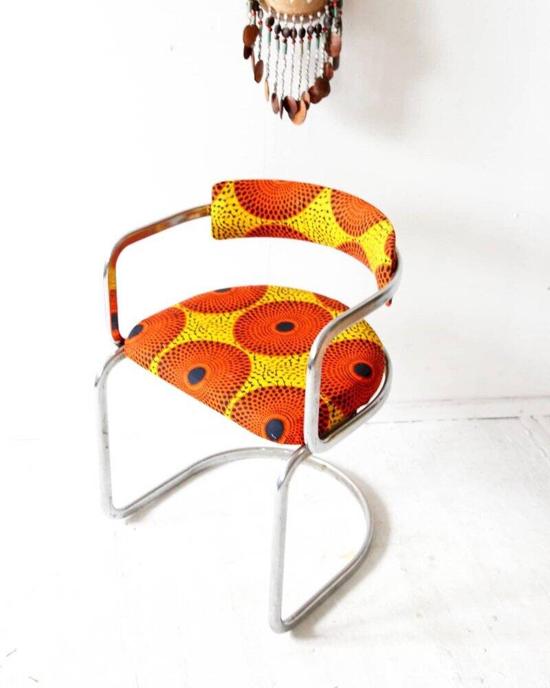 1970s yellow patterned fabric cantilever lounge chair with chrome steel frame.