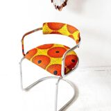 1970s yellow patterned fabric cantilever lounge chair with chrome steel frame.