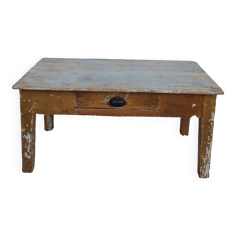 Patinated coffee table with a drawer