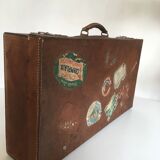 Suitcase of leather with labels of palaces