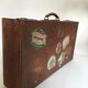 Suitcase of leather with labels of palaces