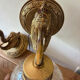 Pair of vintage wall sconces with golden metal swan heads and glass.