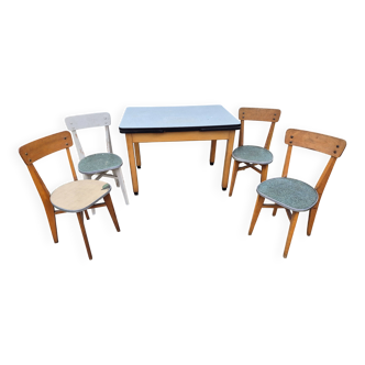 Vintage Scandinavian table and chair set with a wooden frame and formica top.