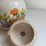 Flowered stoneware teapot with vintage rattan handle