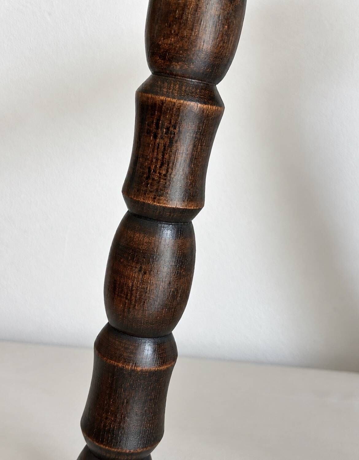 Restored dark wood tripod stool, bobbin leg, elegant furniture.