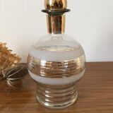 Glass carafe with white granite parts and gold edging. Glass stopper