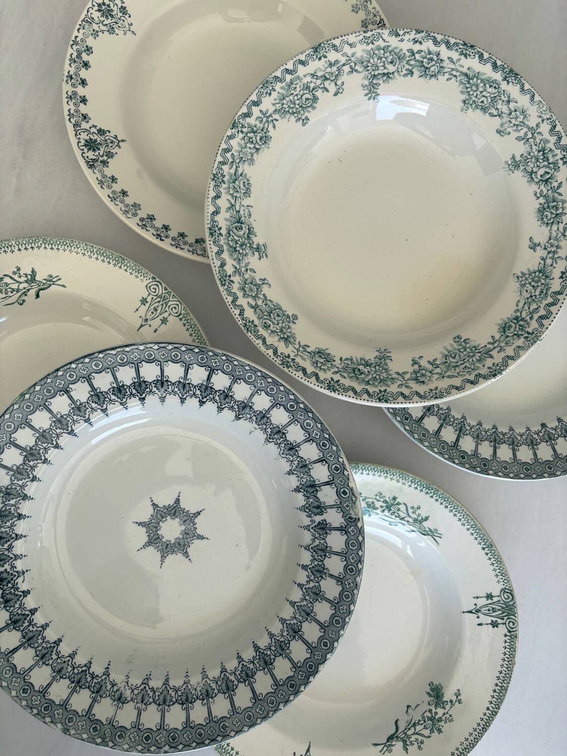A deep plate in blue and green ironstone, antique French earthenware.