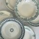 A deep plate in blue and green ironstone, antique French earthenware.