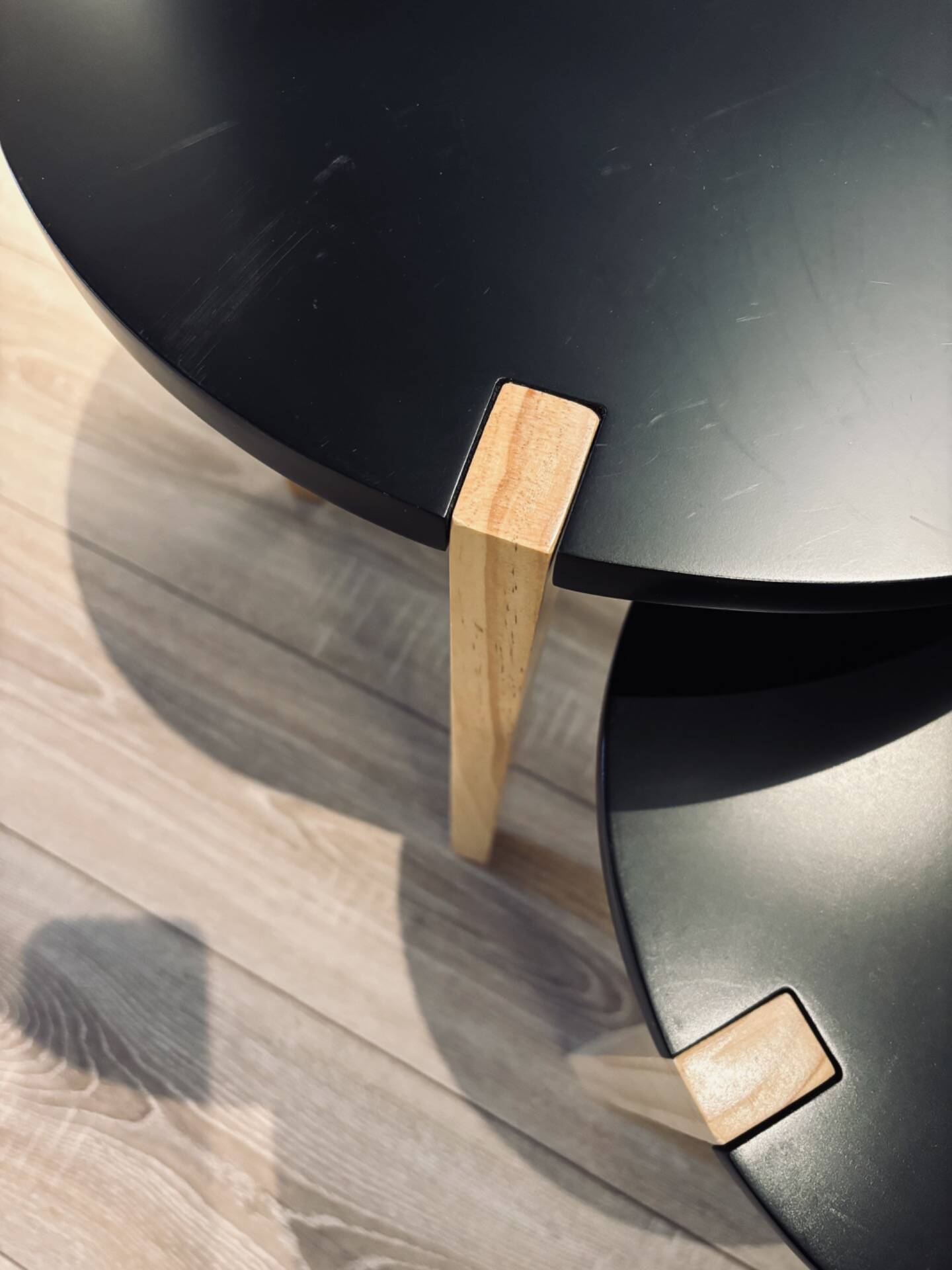 Set of round wooden and black side tables – Scandinavian style