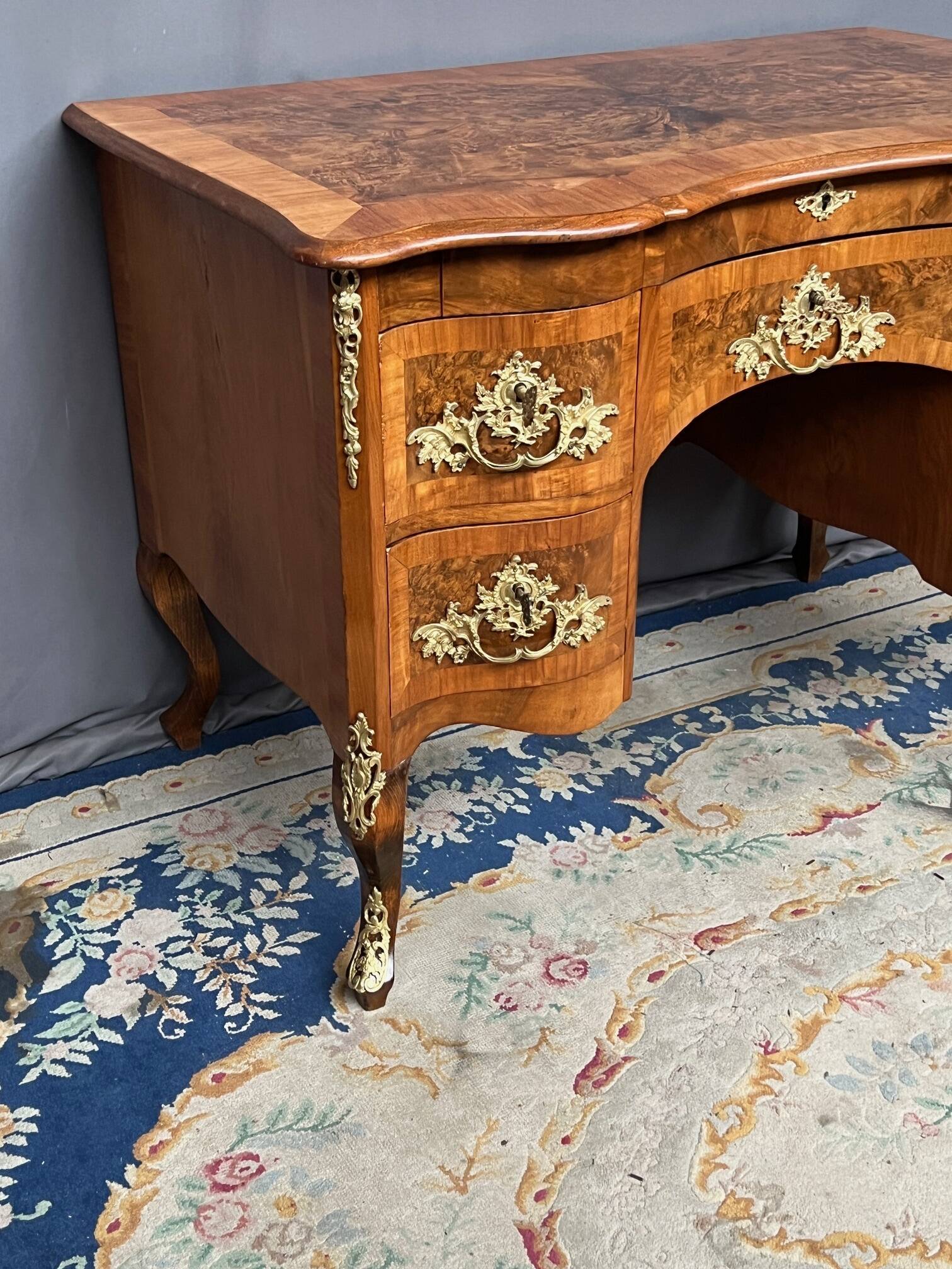 Antique baroque-style desk from Dresden with five drawers.
