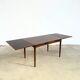 Rosewood dining table with integrated extensions — Denmark, 1960s