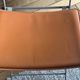 4 folding Sintesi chairs for DWR Lina in metal and vintage camel leather.