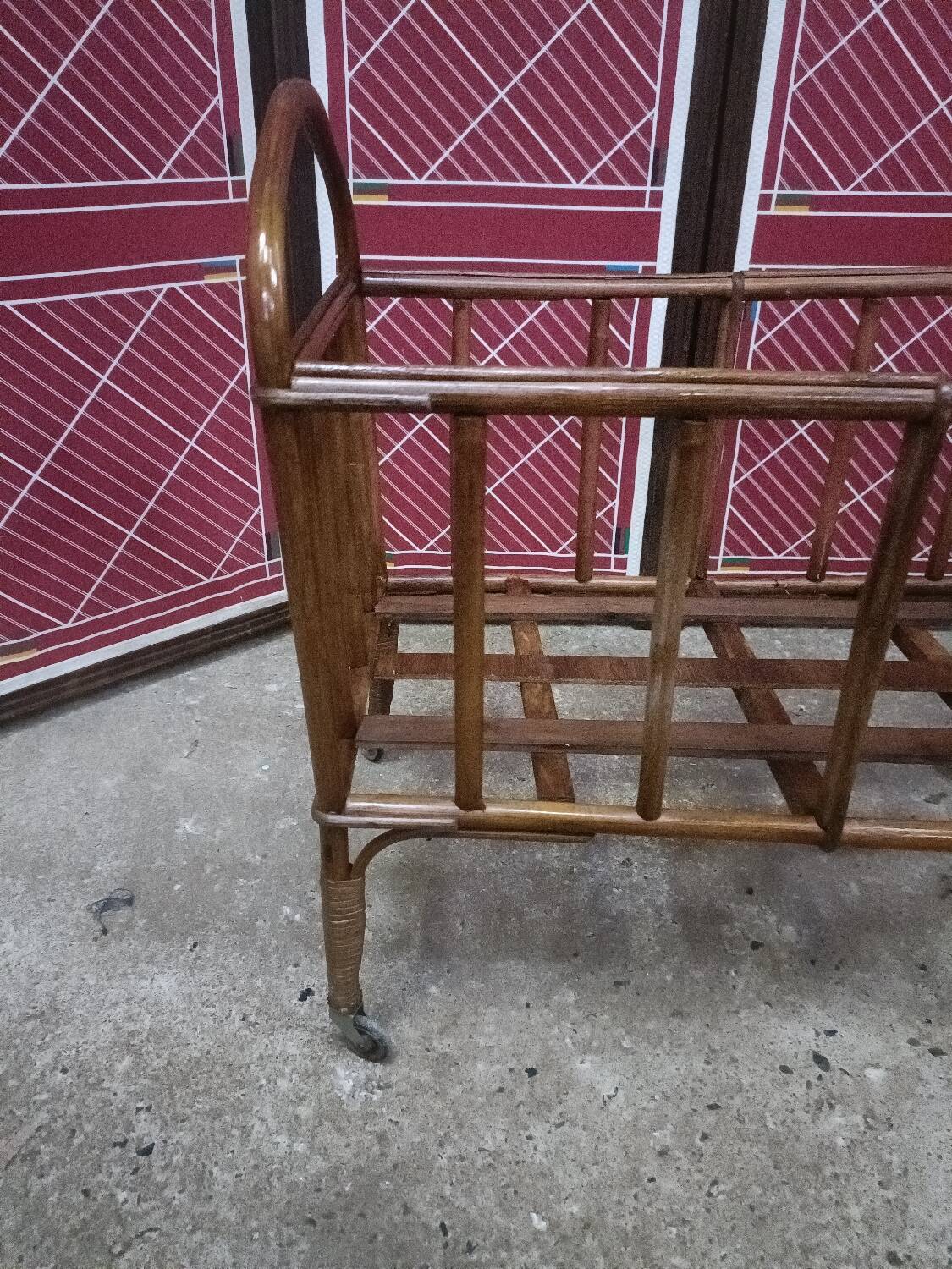 Old small bed or cradle for baby in vintage rattan