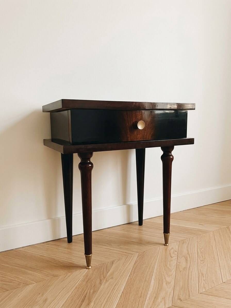 Vintage Art Deco bedside table in dark wood with gold details.
