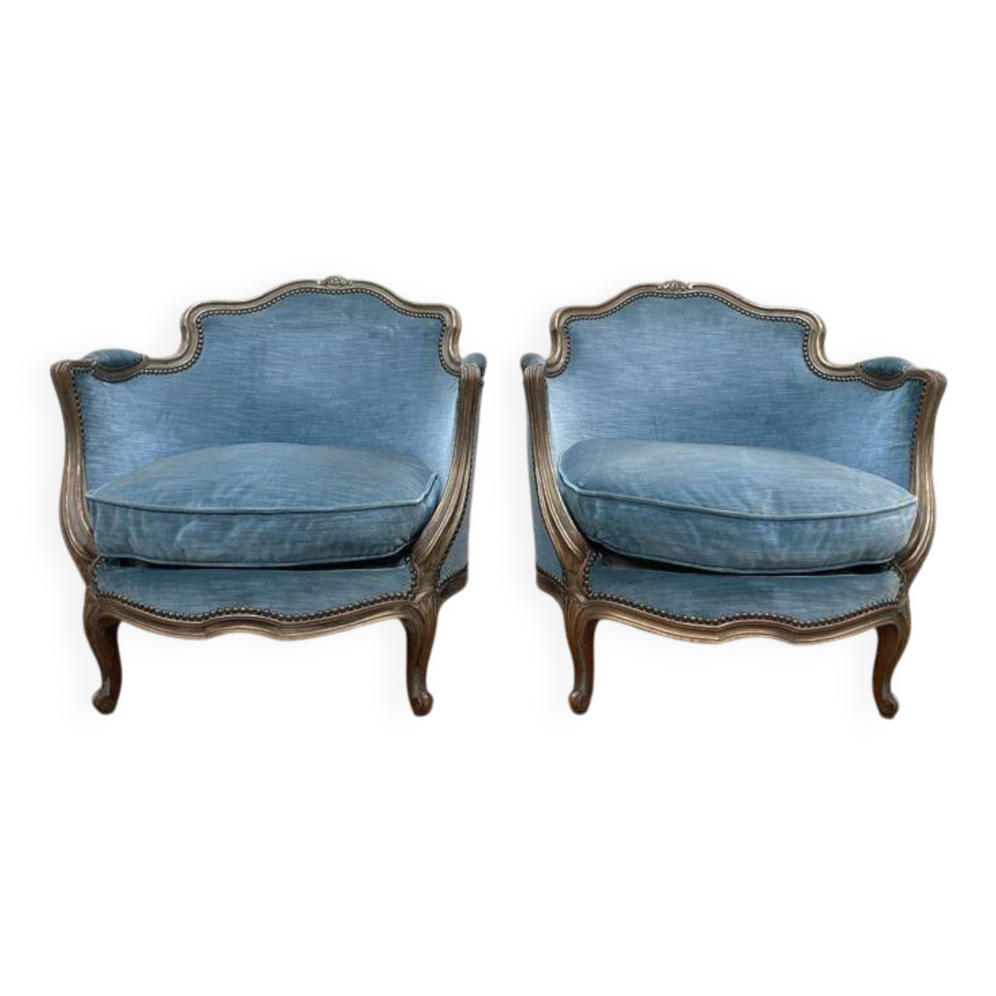 Paire de fauteuils bergères de style Louis XV en velours bleu et bois doré