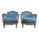 Paire de fauteuils bergères de style Louis XV en velours bleu et bois doré