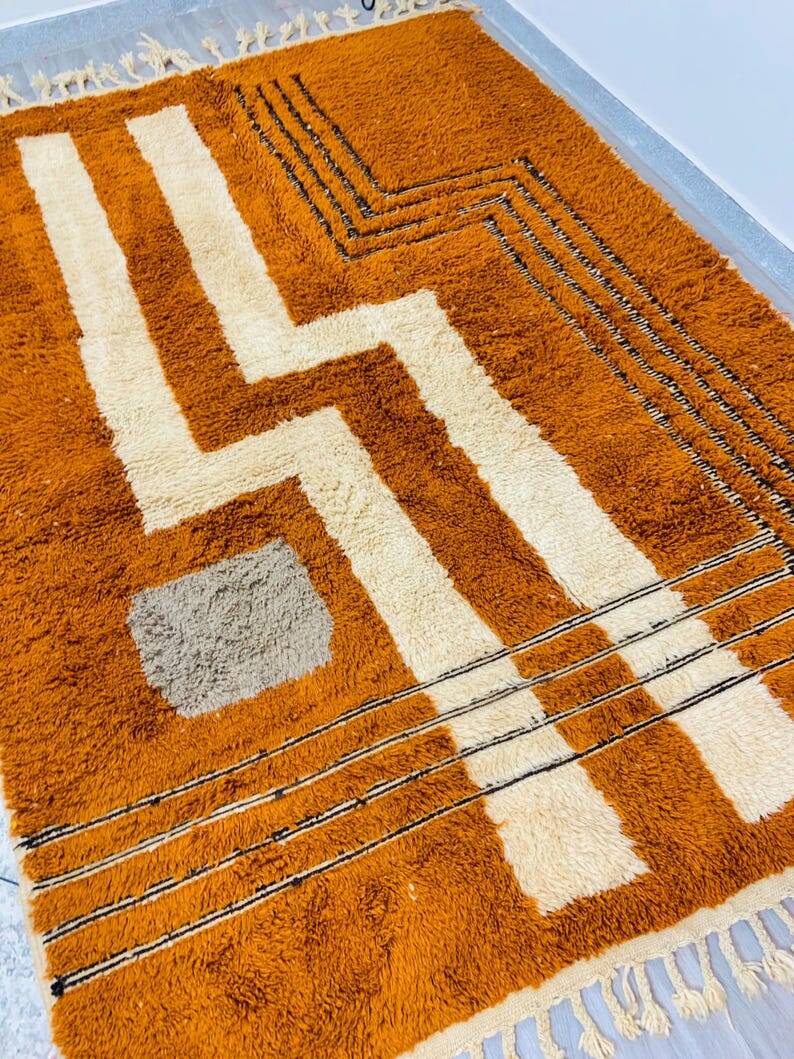 Modern Moroccan rug in rust wool with cream lines 150/250 cm