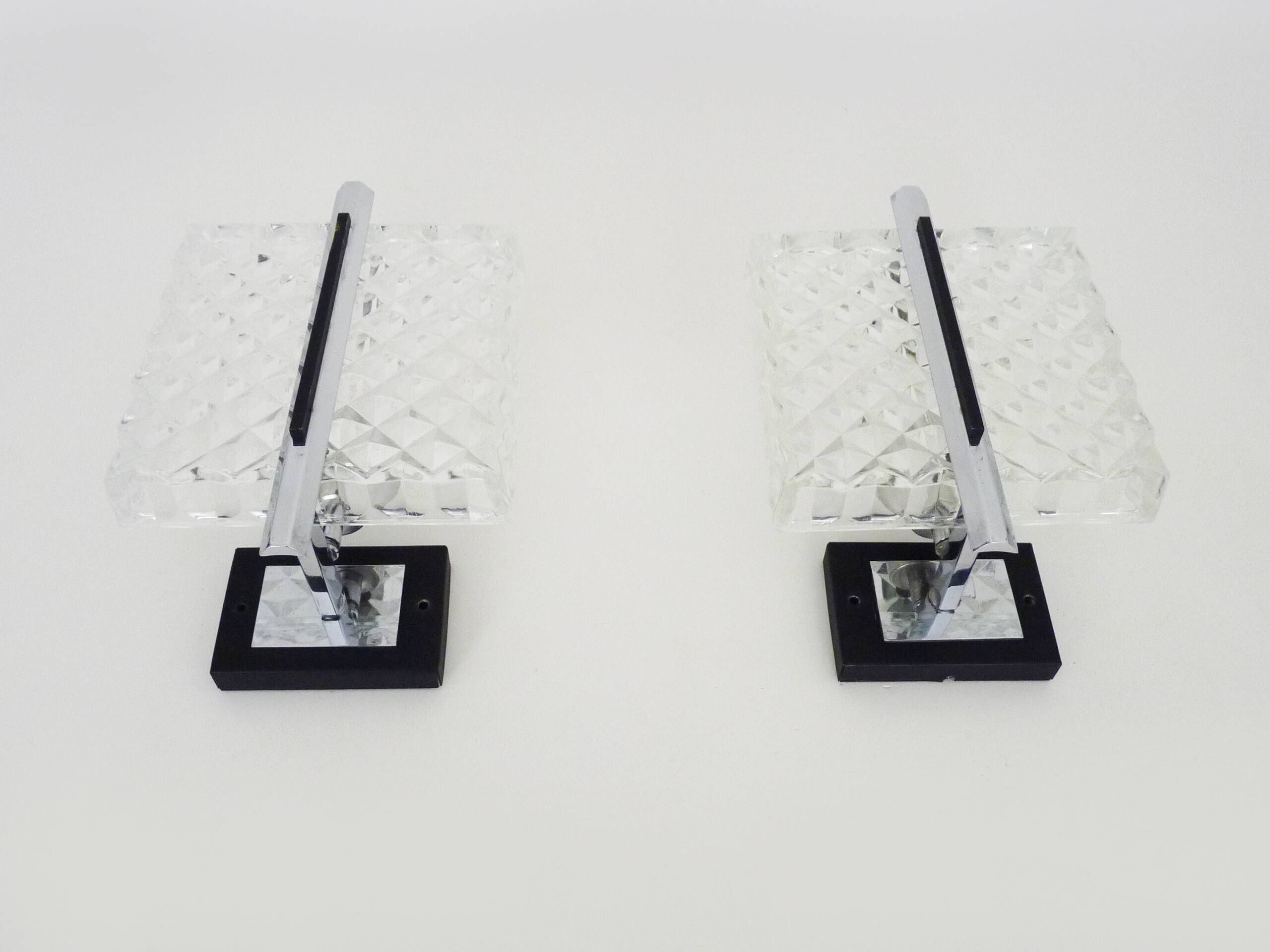 Pair of modernist glass and chrome metal wall sconces. 1960s-70s