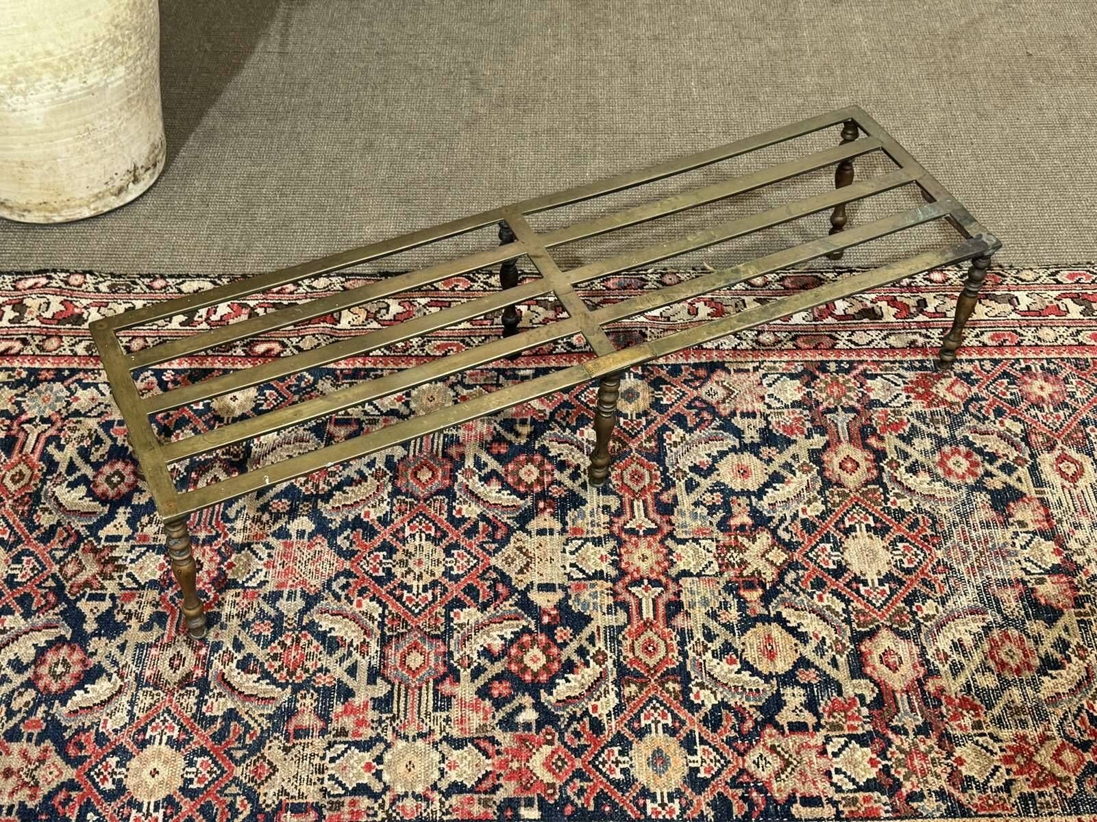 English brass footrest for fireplace from the late 19th century.