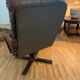 Vintage leather armchair with wooden armrests