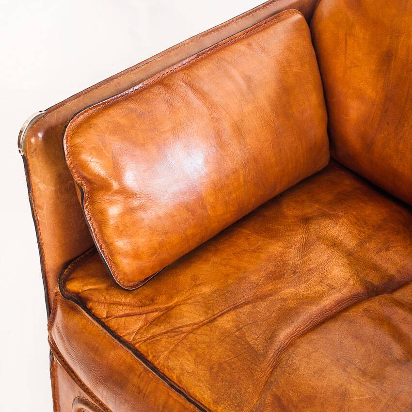 Vintage club armchair by Roche Bobois. Camel buffalo leather. France, 1980s.