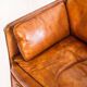 Vintage club armchair by Roche Bobois. Camel buffalo leather. France, 1980s.