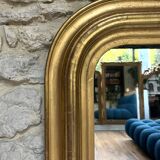 Antique mirror 136.5/98cm Louis-Philippe pearl-gilded with gold leaf.