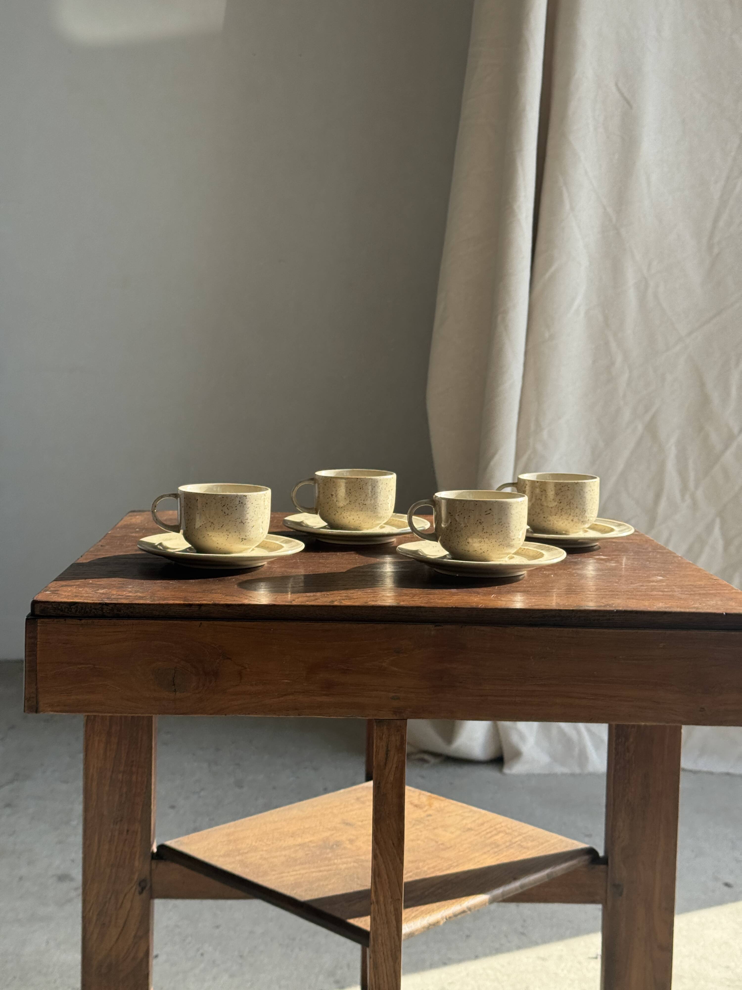 Set of 4 vintage speckled beige stoneware coffee cups.
