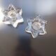 2 star-shaped candle holders