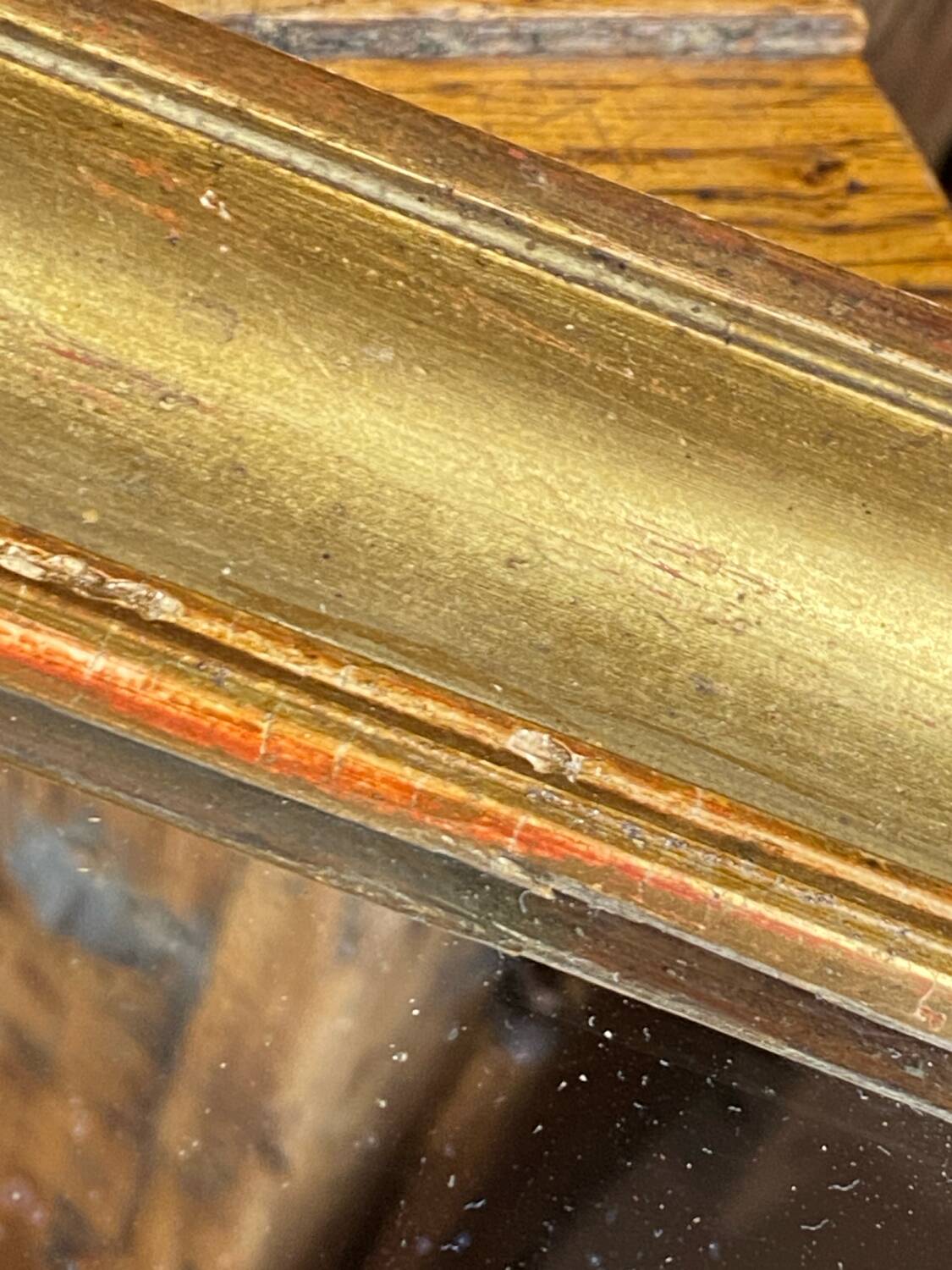 Antique mirror in gilded wood