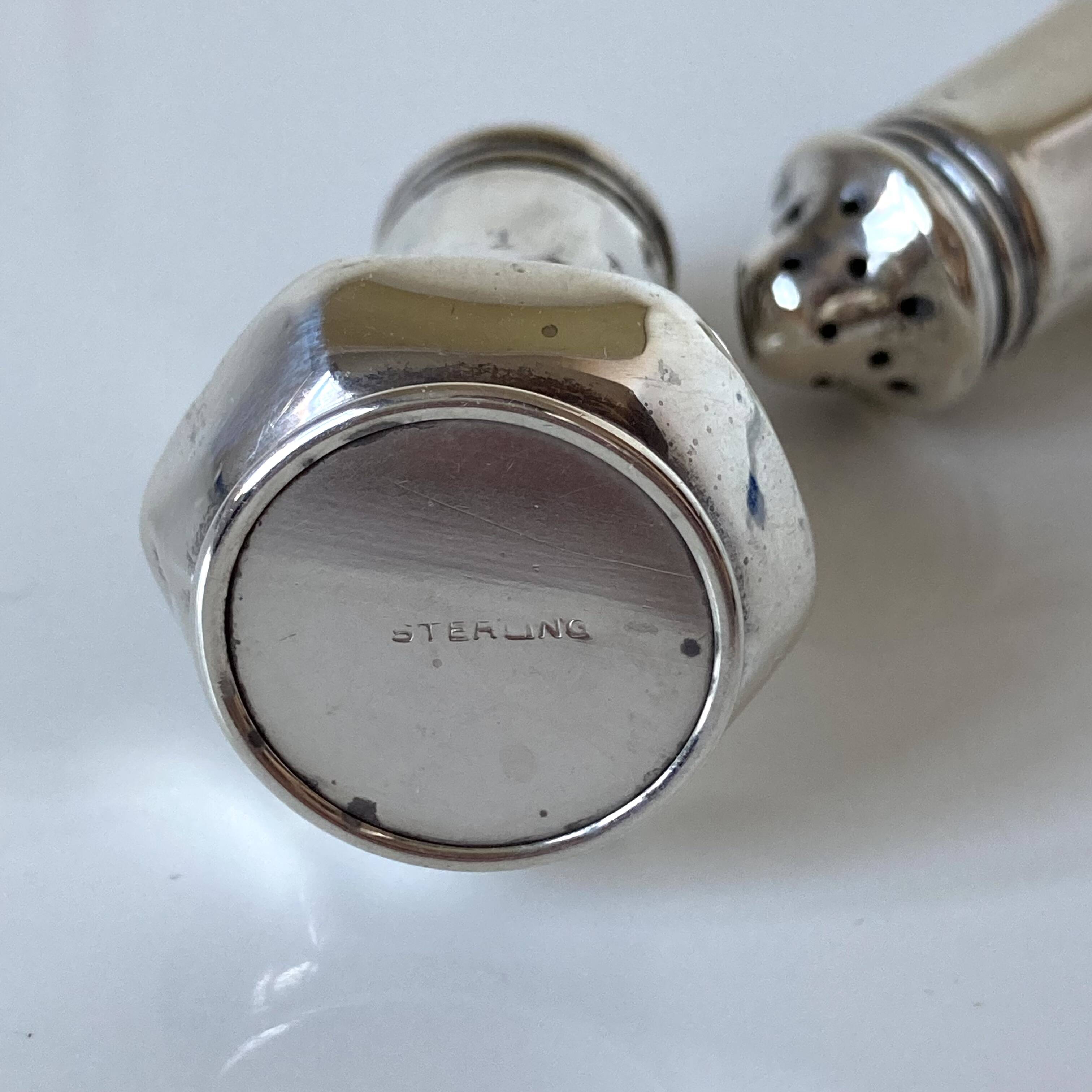 Antique salt and pepper shakers in solid English silver