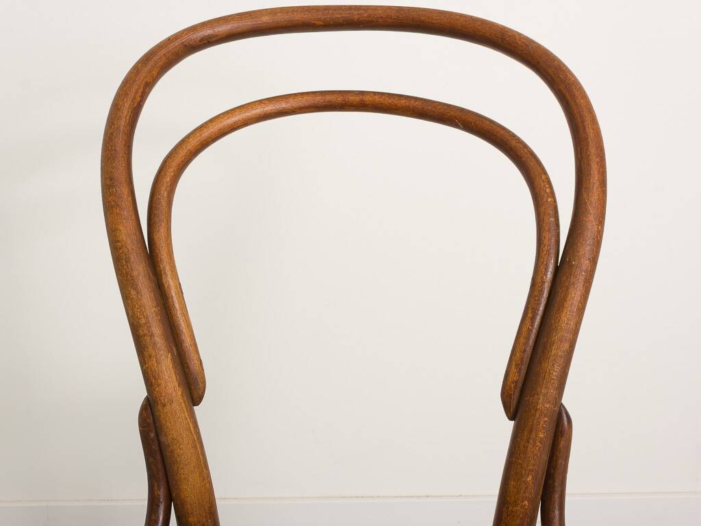 Bistro chair with curved wooden armrests and canning seat